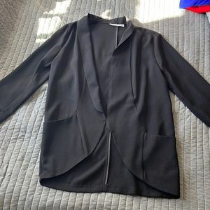 Lush casual unlined black jacket. 31” length in back from neckline to bottom.